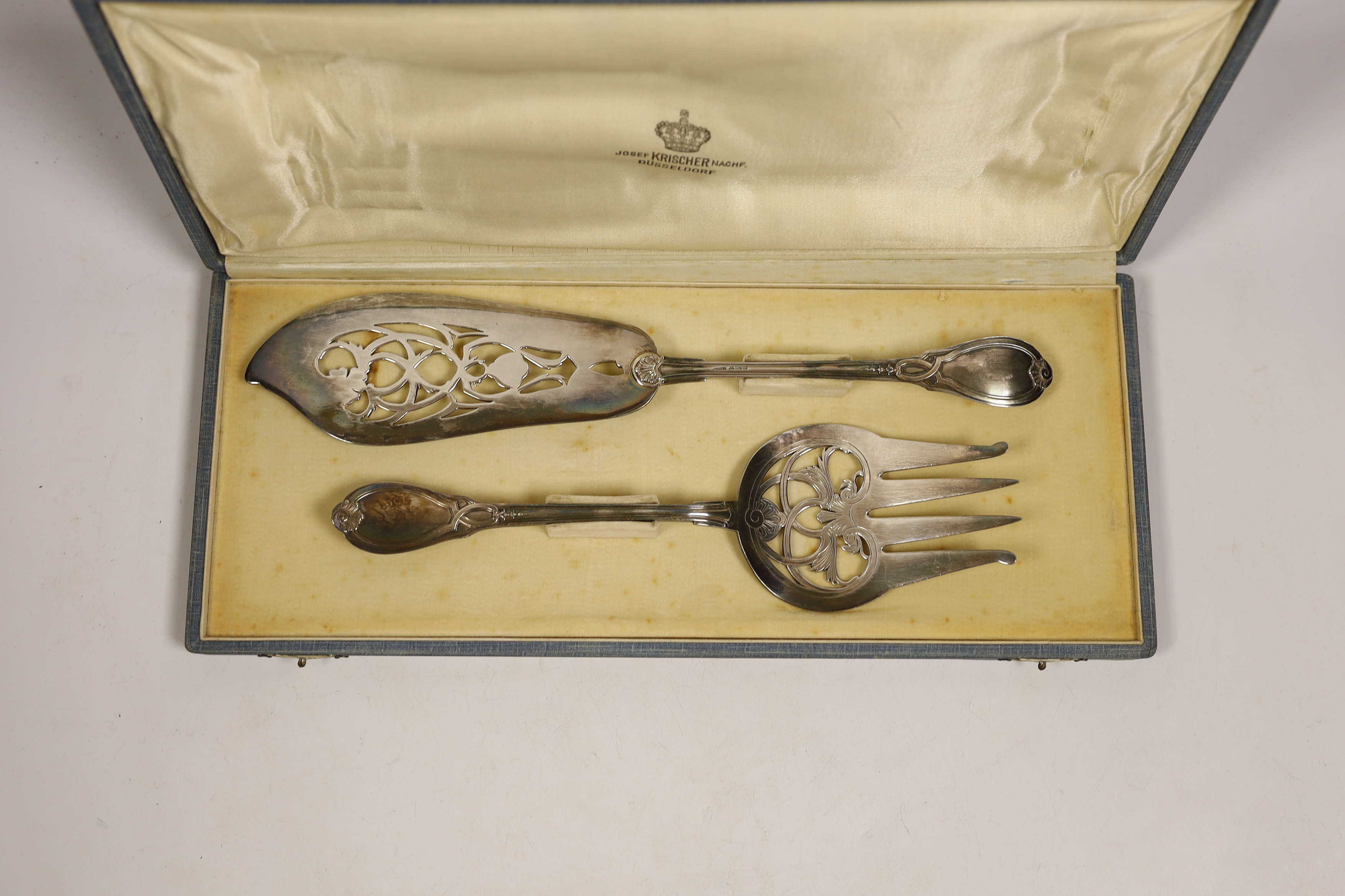 A cased pair of German 800 standard white metal fish servers by Josef Krischer, knife 29.4cm, 7.8oz.